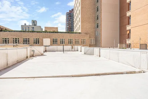 a large white building with a outdoor space