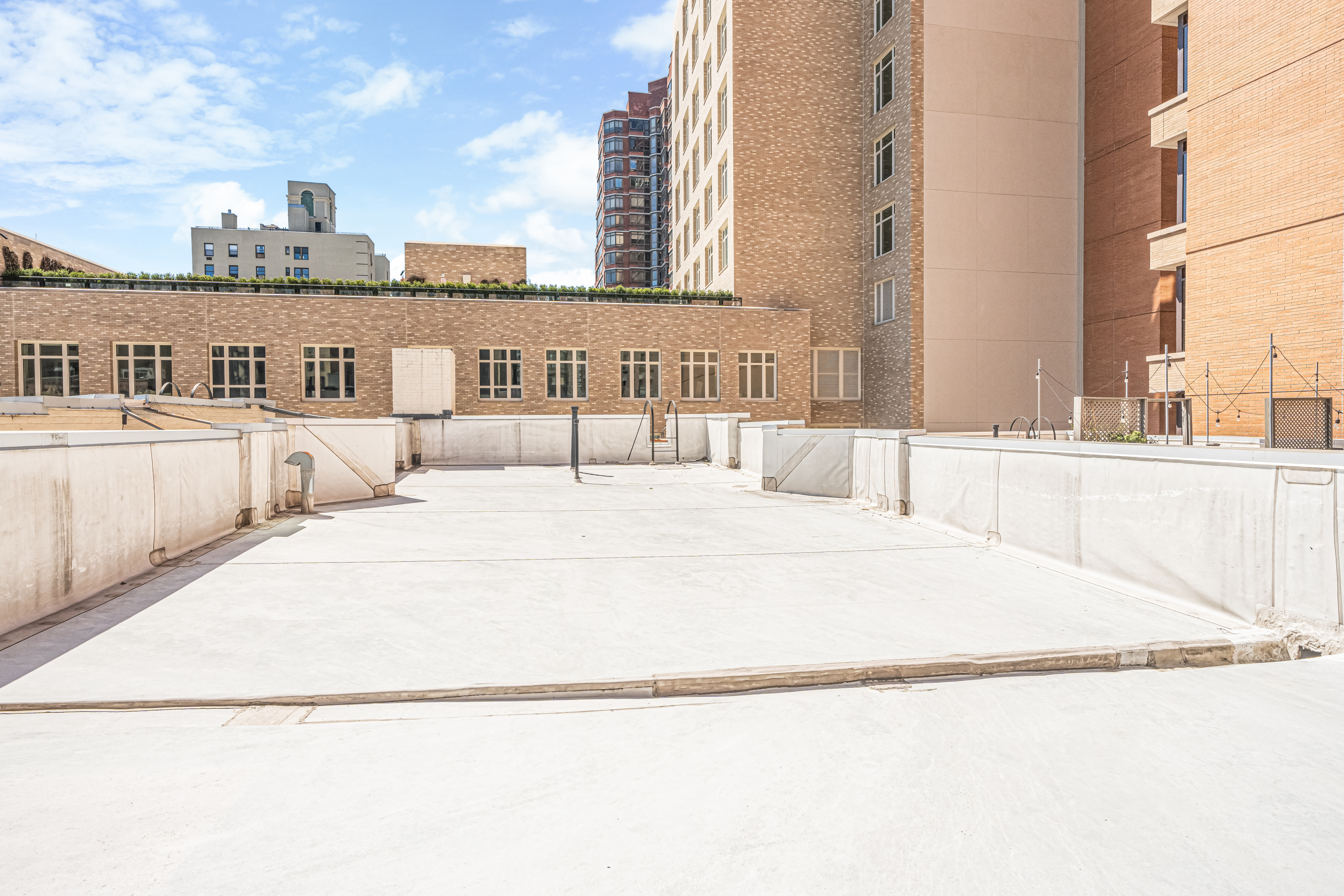 212 West 85th Street, Unit 5W Manhattan, NY 10024 - Photo 8 of 11 a large white building with a outdoor space
