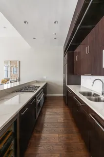 a large kitchen with a stove and a sink