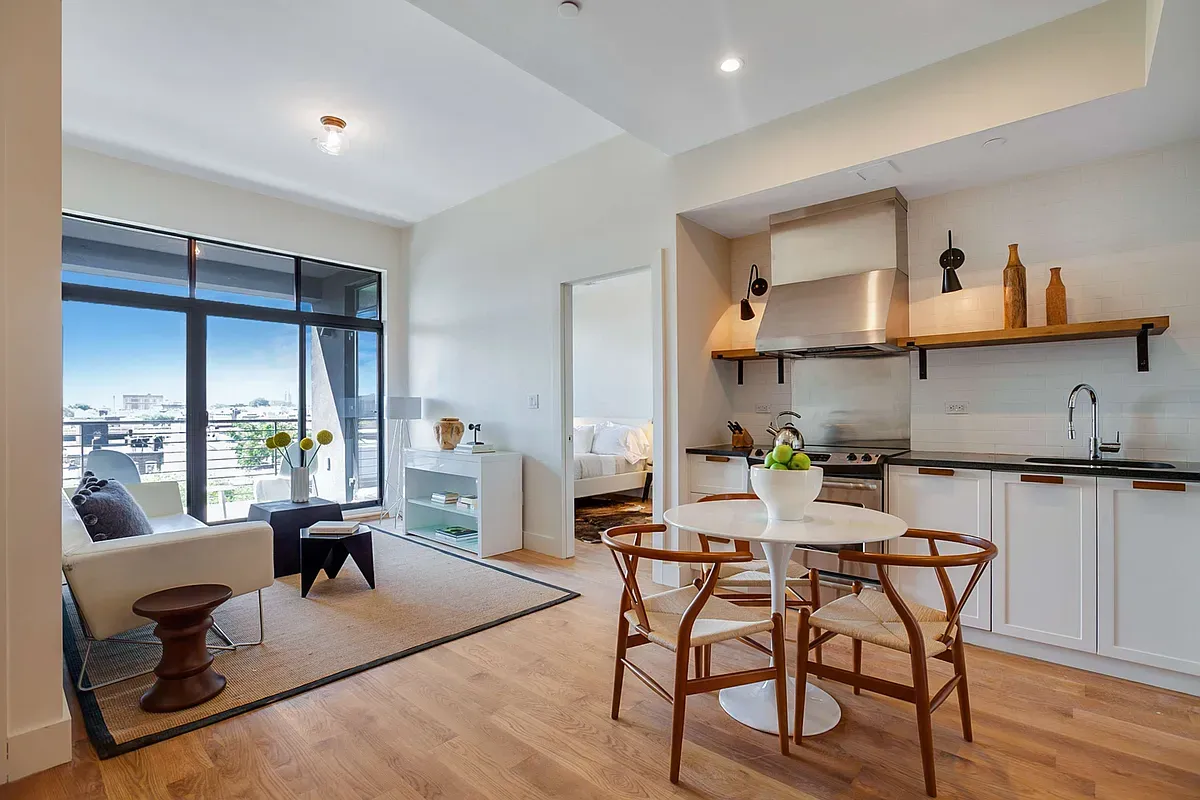 a view of a dining room with furniture window and outside view