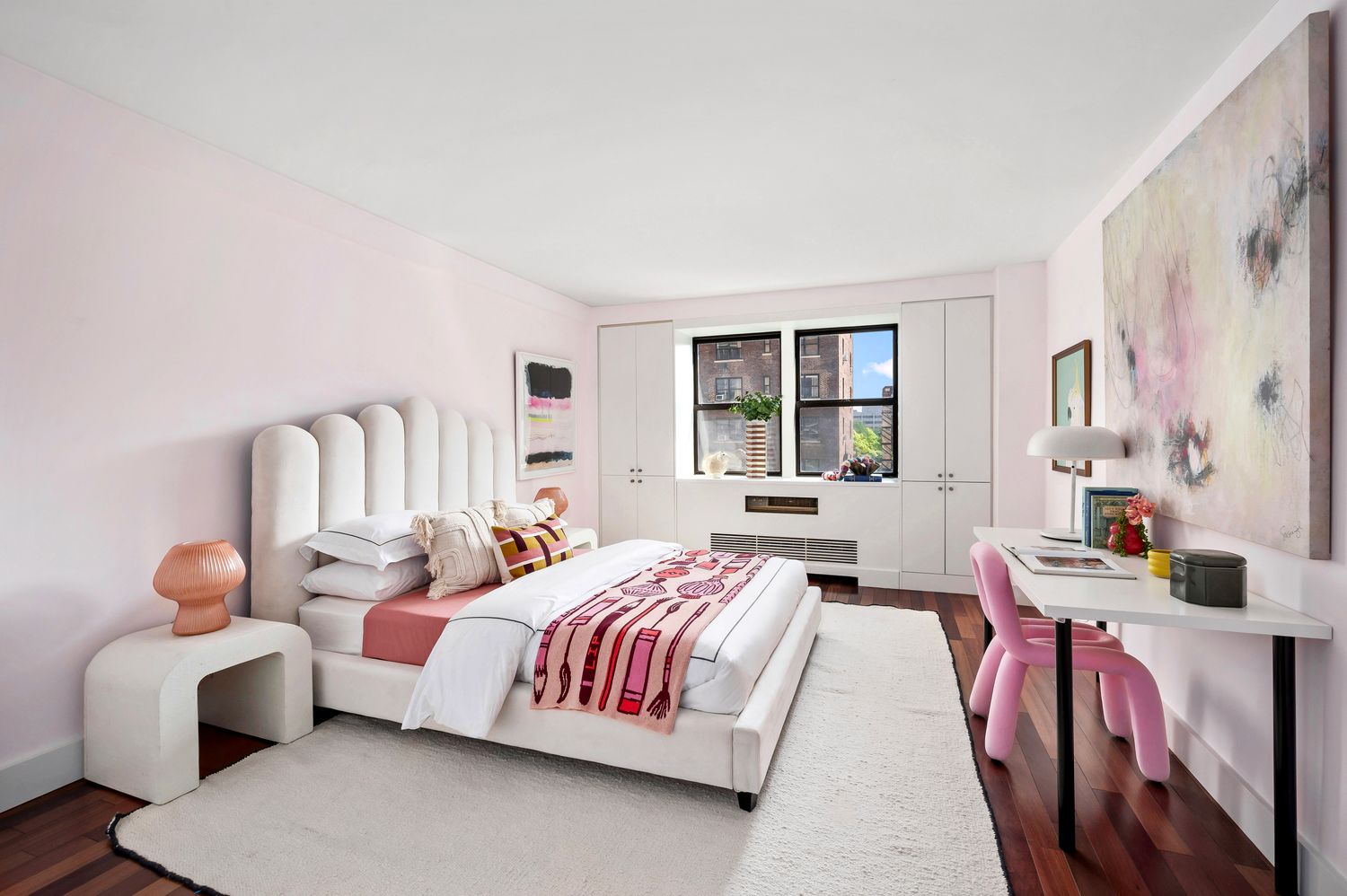 a bedroom with bed and a window