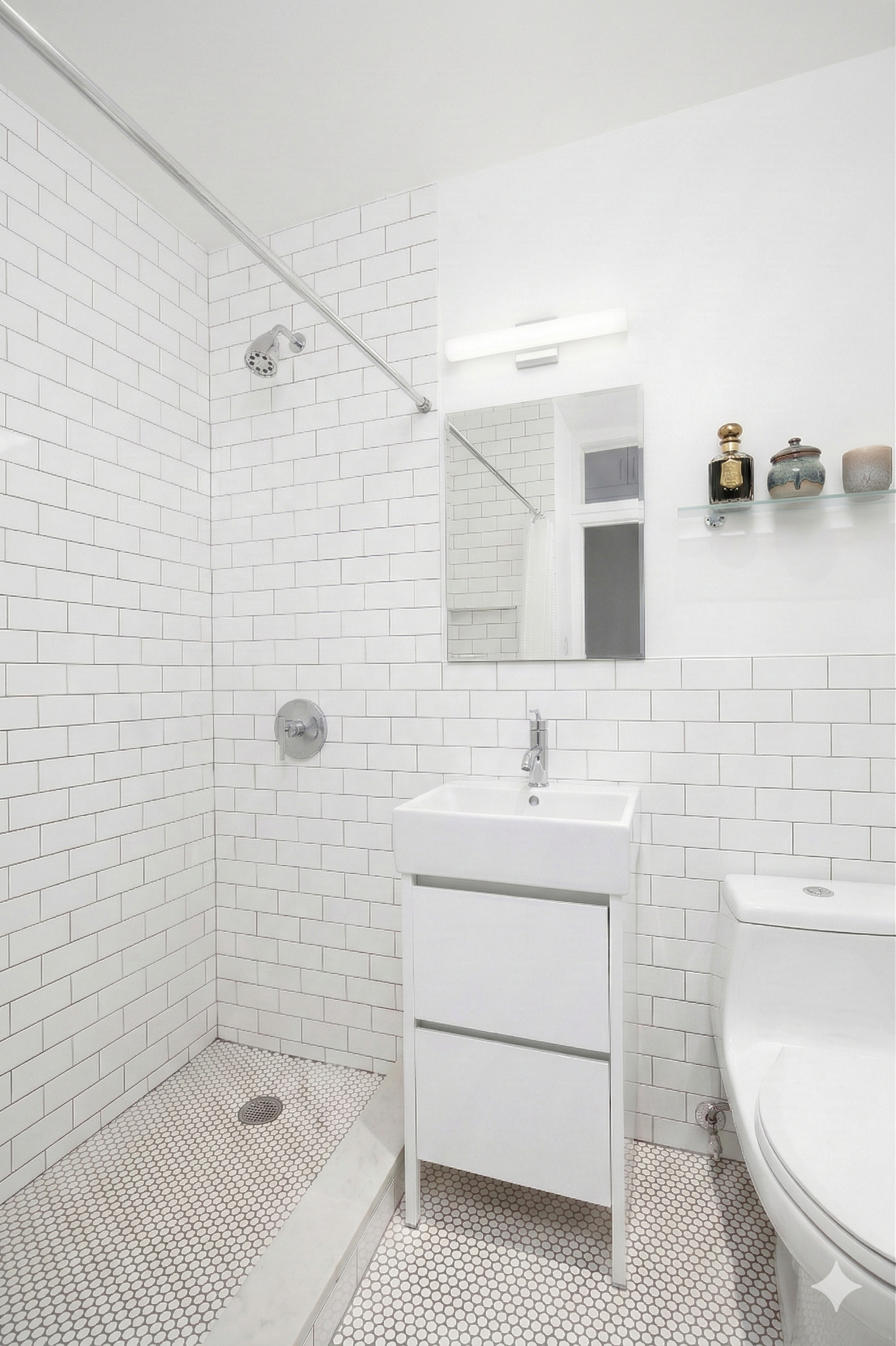 315 7th Avenue, Unit 17A Manhattan, NY 10001 - Photo 8 of 12 a bathroom with a sink a toilet and shower
