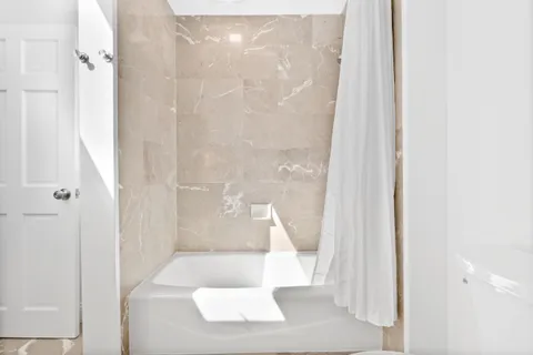 a bedroom with a bed and chair