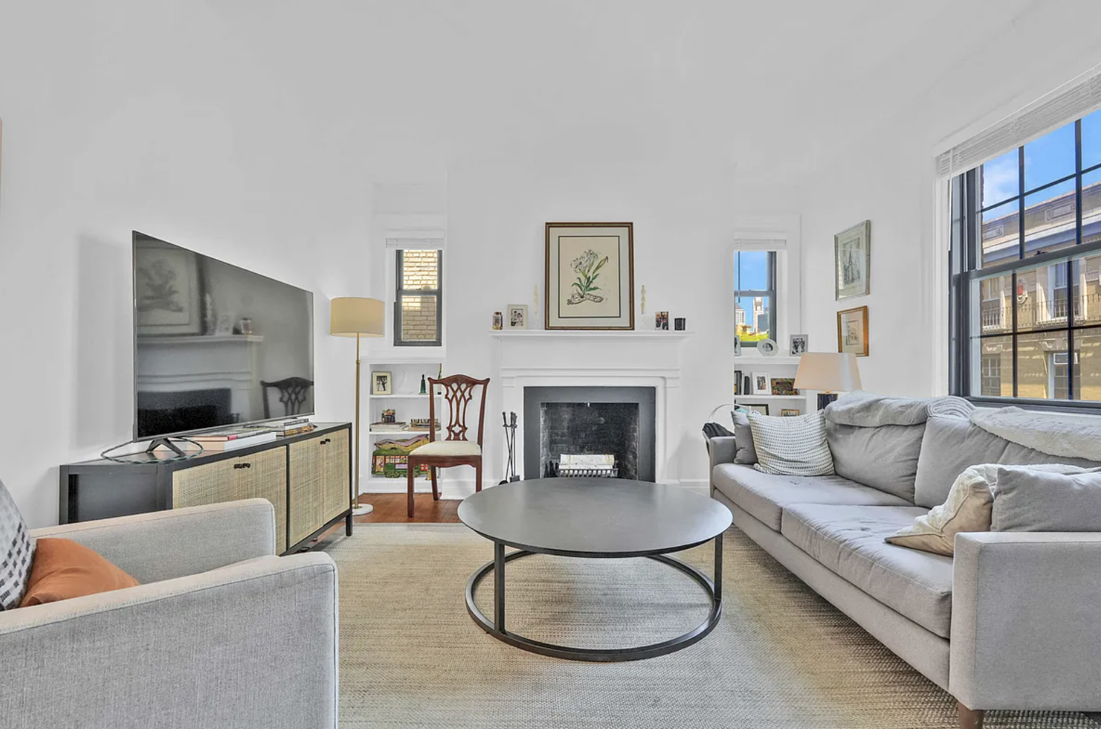 12 Clark Street, Unit 5B Brooklyn, NY 11201 - Photo 1 of 9 a living room with furniture and a fireplace