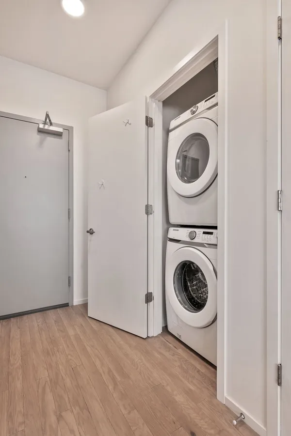 a utility room with sink dryer and washer