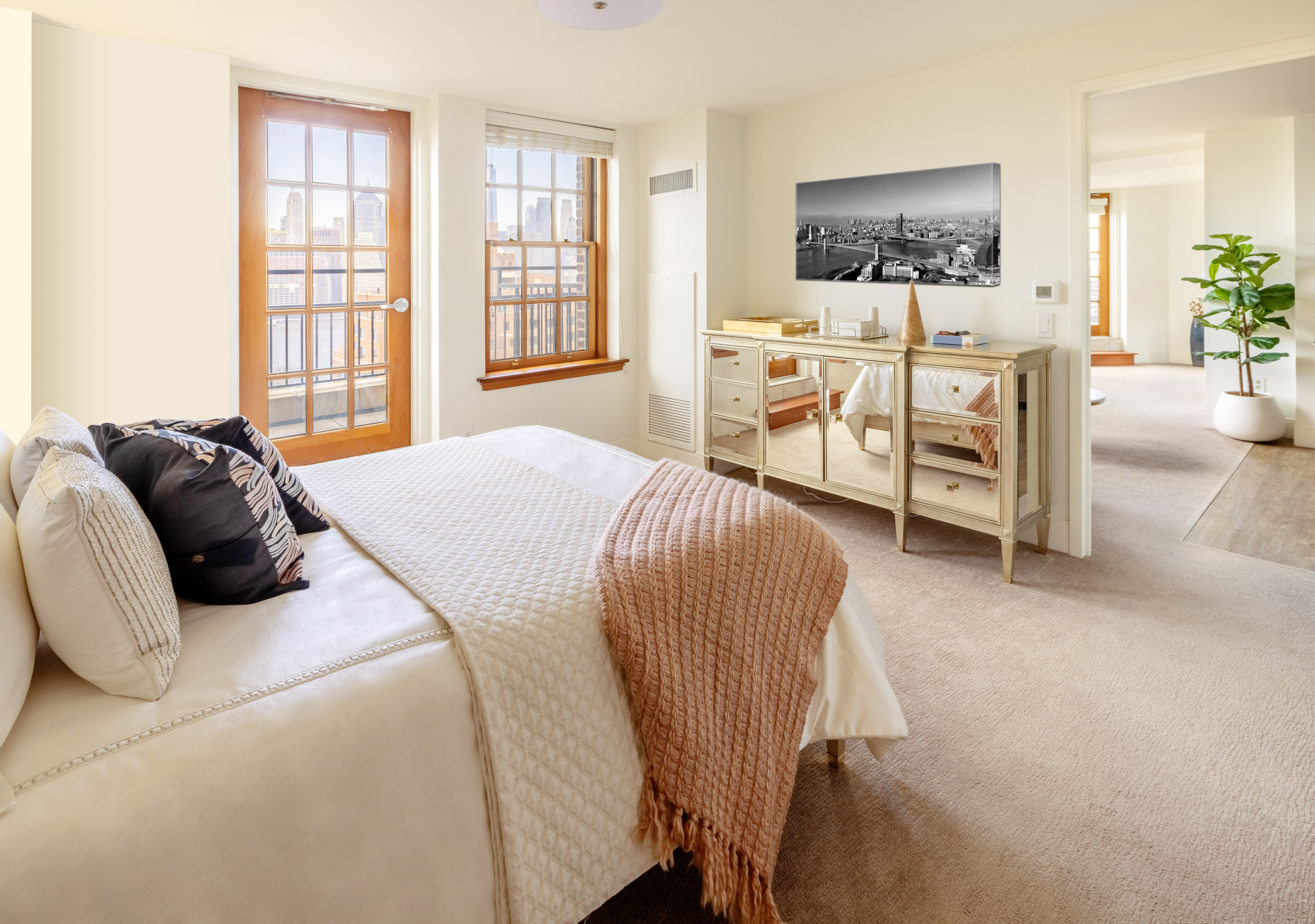 21 Clark Street, Unit 1113 Brooklyn, NY 11201 - Photo 7 of 10 a bedroom with a bed and a flat screen tv