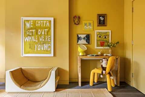 a kitchen with a table chairs a sink and a stove