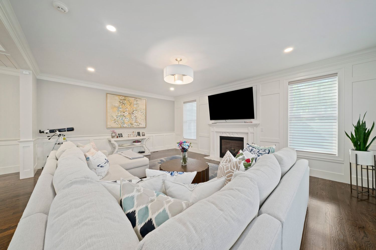 a bathroom with double vanity sink a mirror and a bathtub
