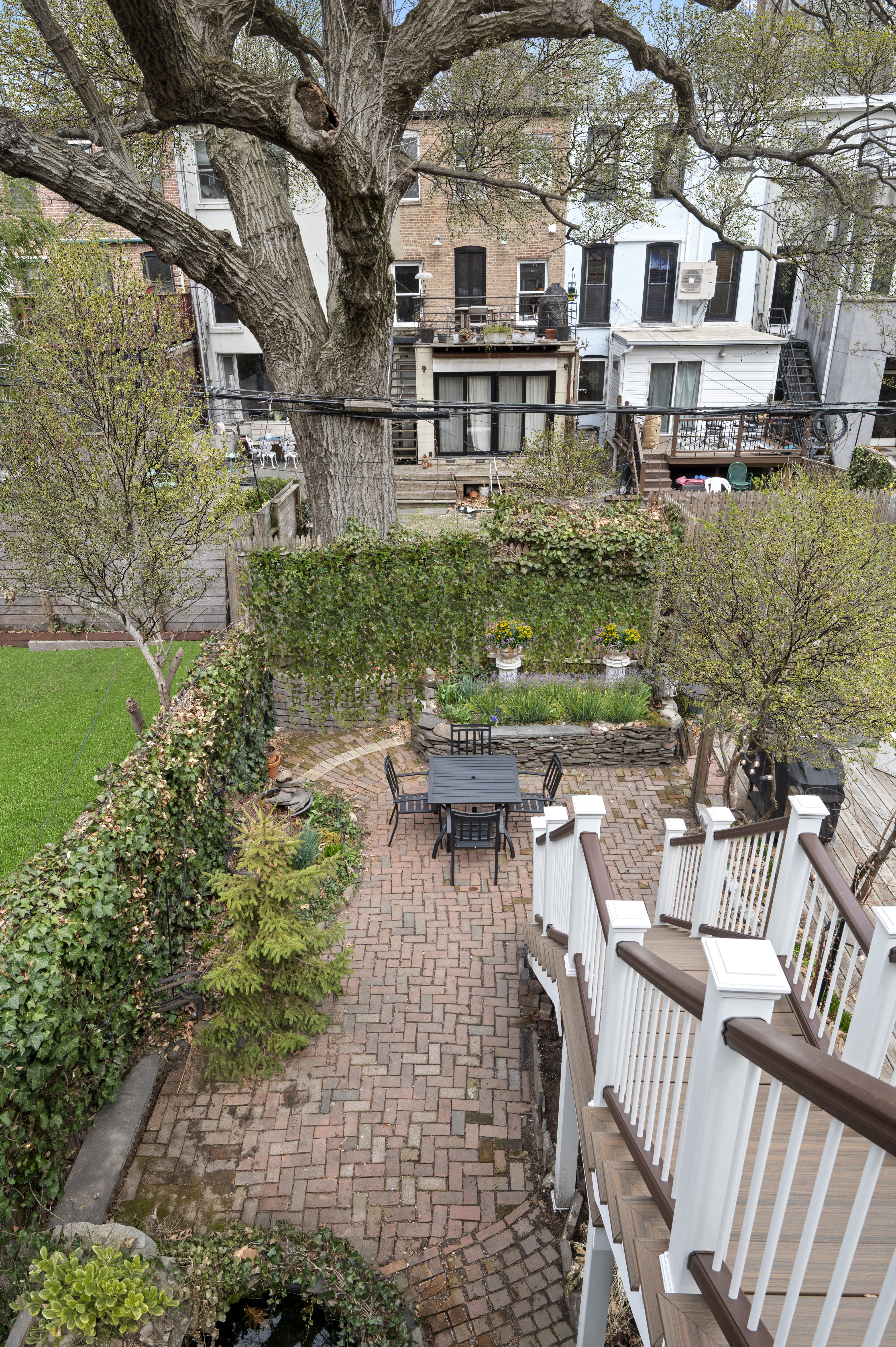 457 Warren Street Brooklyn, NY 11217 - Photo 13 of 16 a view of a patio with couches table and chairs and potted plants
