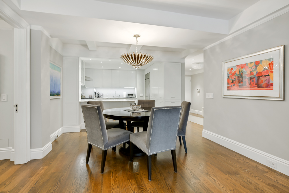 7 East 85th Street, Unit 5AB Manhattan, NY 10028 - Photo 4 of 12 a view of a dining room with furniture and wooden floor