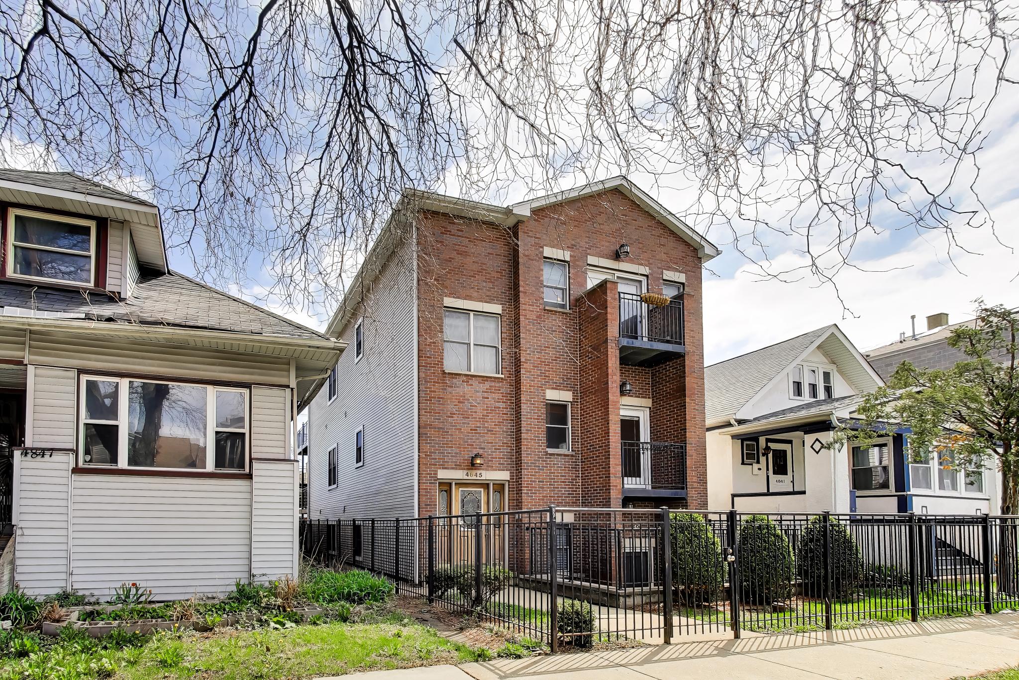4845 North Springfield Avenue, Unit 2 Chicago, IL 60625 - Photo 2 of 32 a front view of a house with street