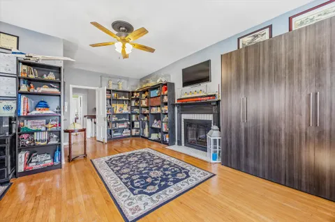 a bed room with a book shelf and a book shelf