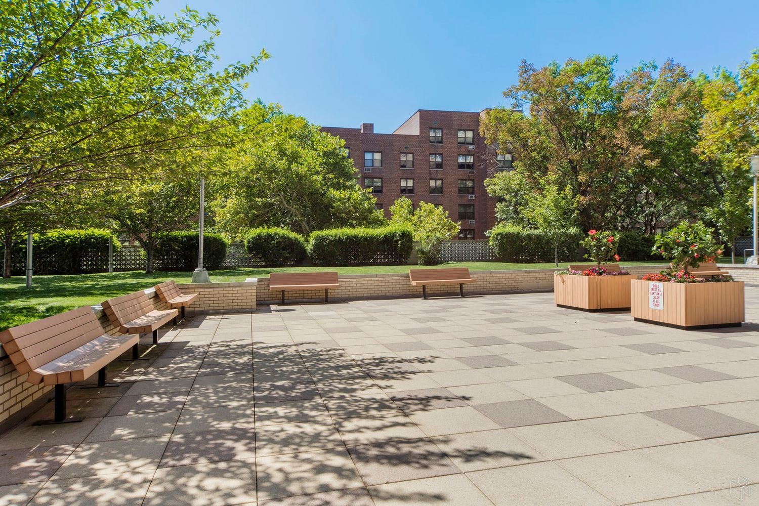 102-10 66th Road, Unit 21K Queens, NY 11375 - Photo 12 of 16 a view of a terrace with a bench