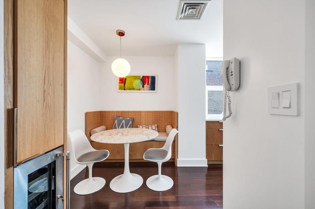2628 Broadway, Unit 15B Manhattan, NY 10025 - Photo 10 of 21 a view of a dining room with furniture and wooden floor