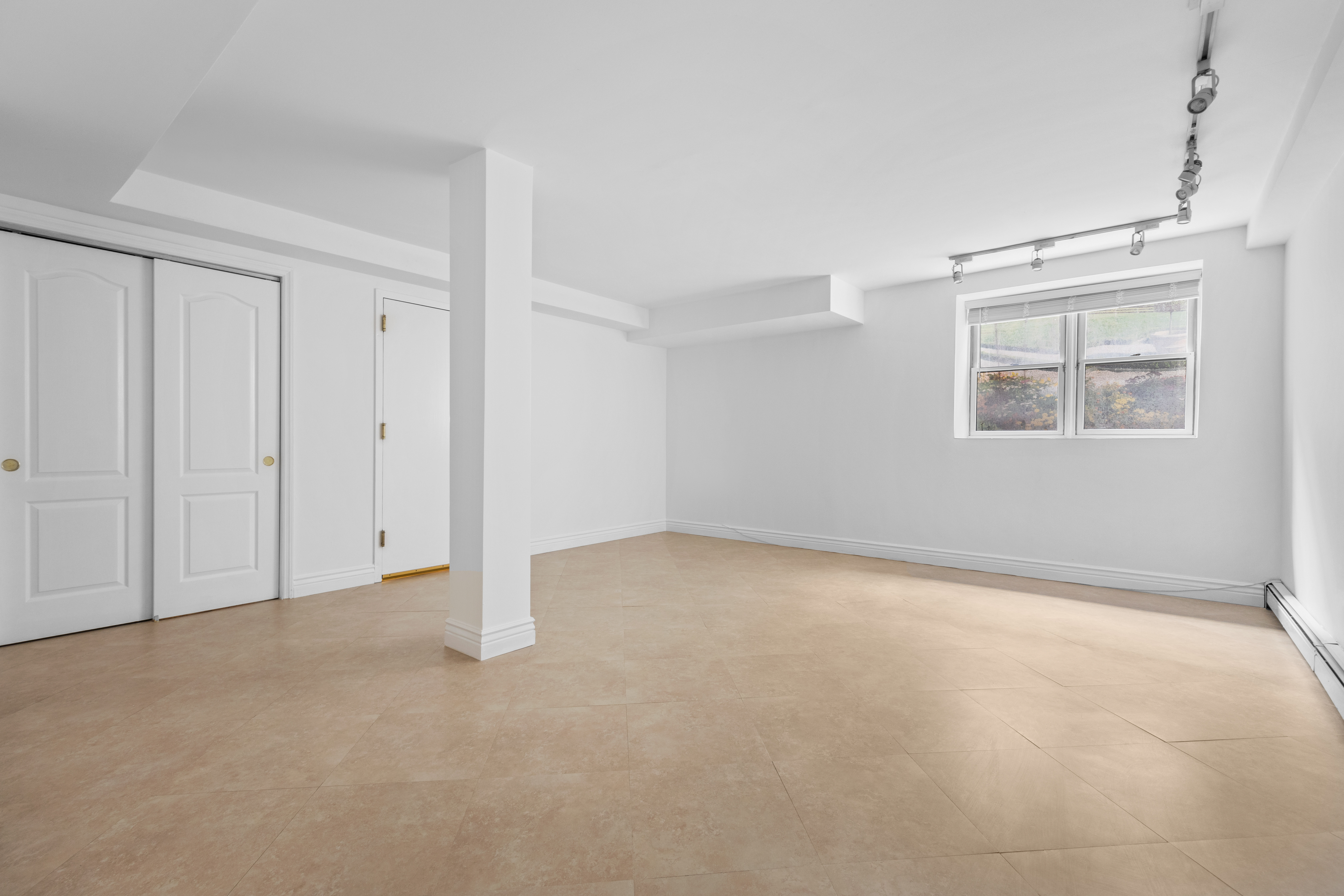 125 Bergen Street, Unit 1A Brooklyn, NY 11201 - Photo 5 of 9 a view of an empty room with a window
