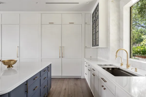 a kitchen with a sink and cabinets