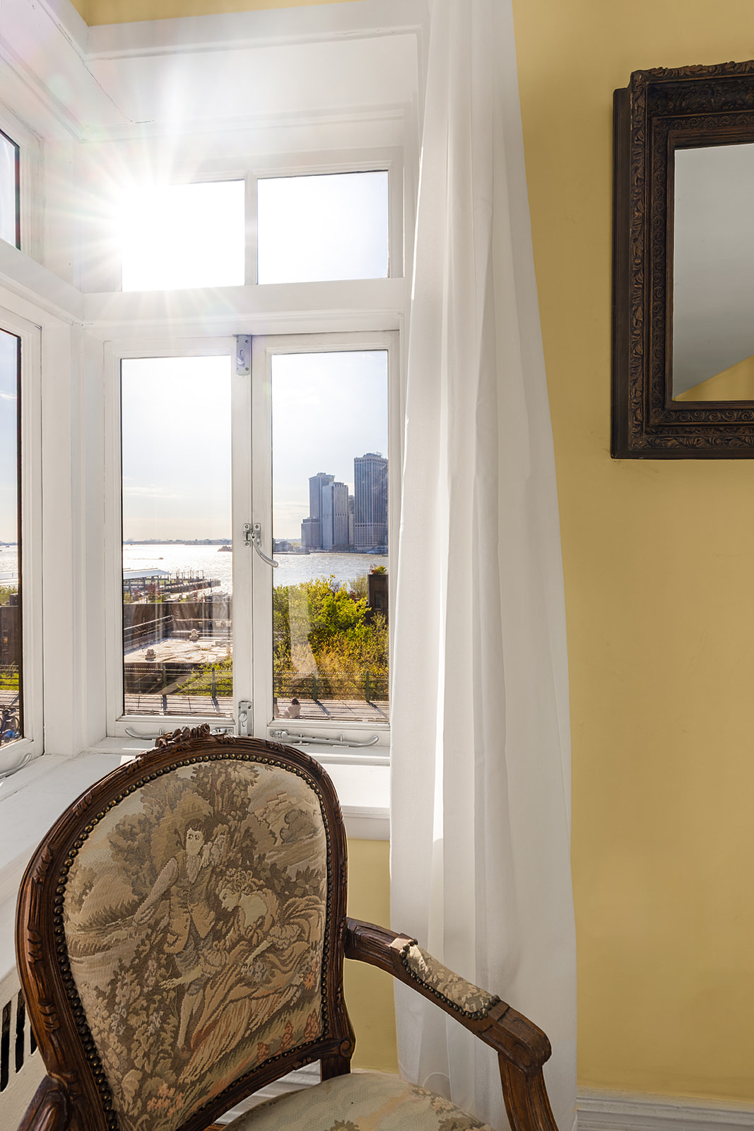 73 Columbia Heights, Unit C1 Brooklyn, NY 11201 - Photo 2 of 14 a bed sitting in a bedroom next to a window