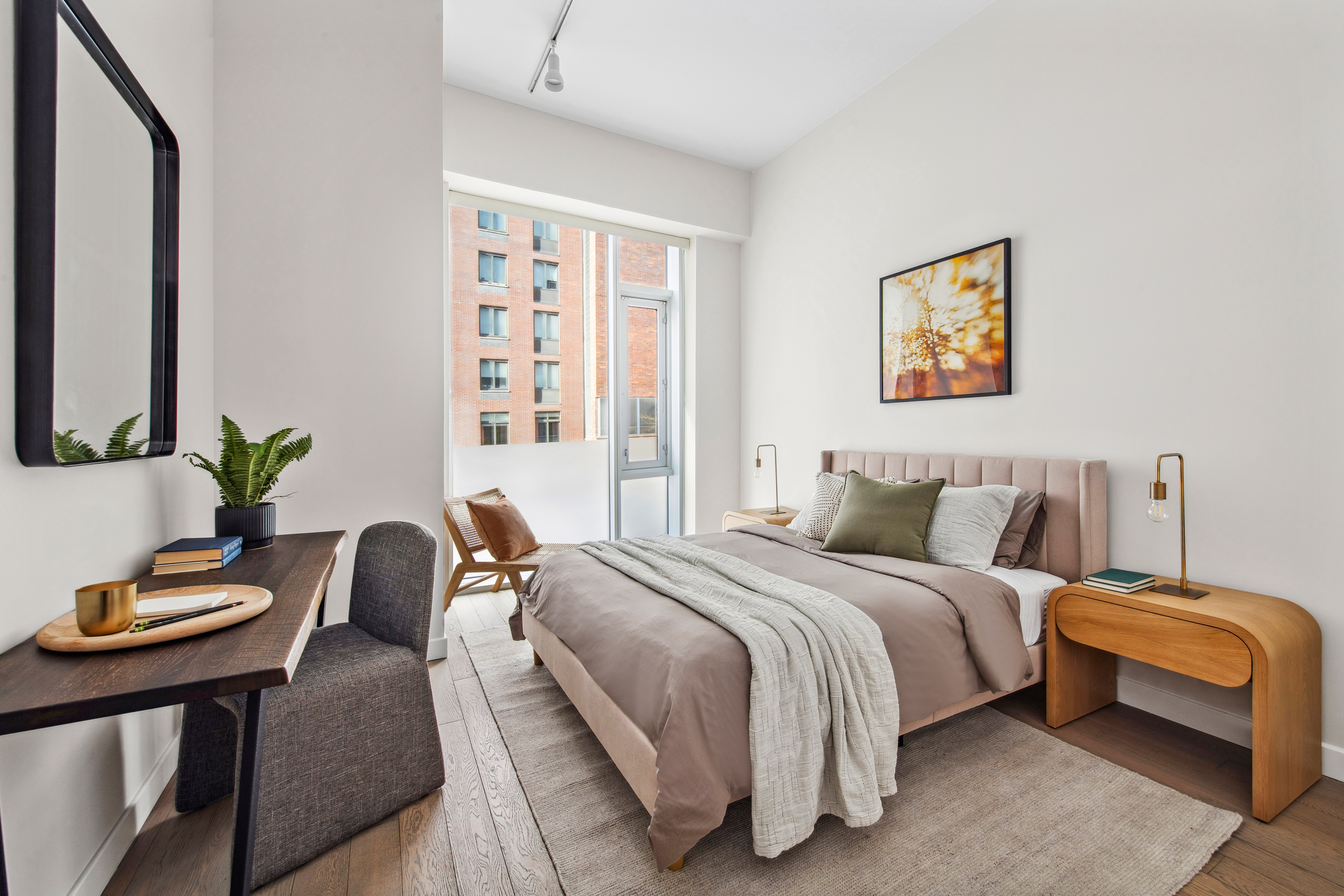 505-513 West 43rd Street, Unit 2B Manhattan, NY 10036 - Photo 7 of 18 a bedroom with bed and a couch