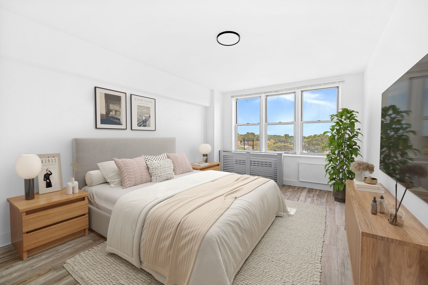 a spacious bedroom with a bed and a couch