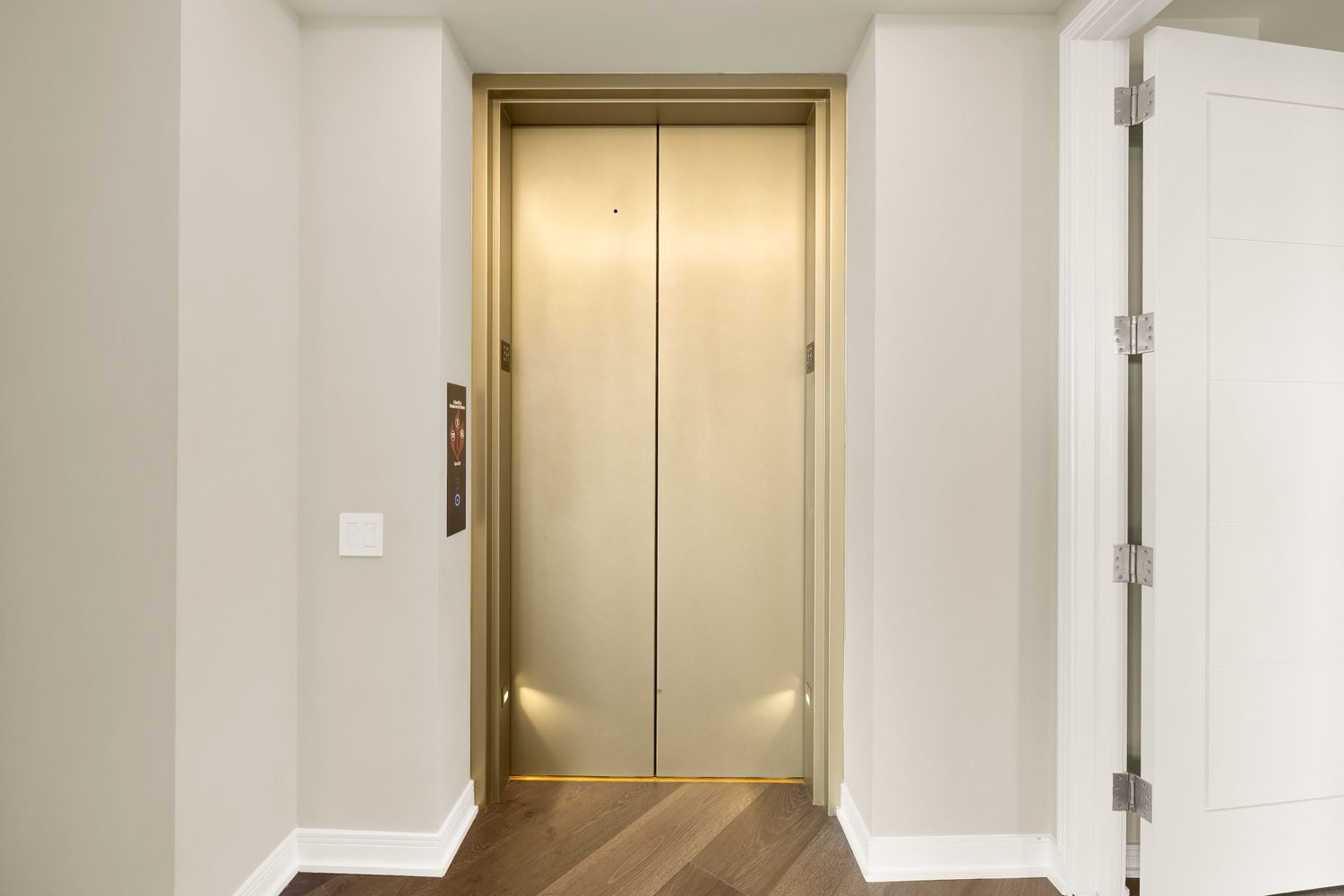 a living room with furniture and floor to ceiling windows