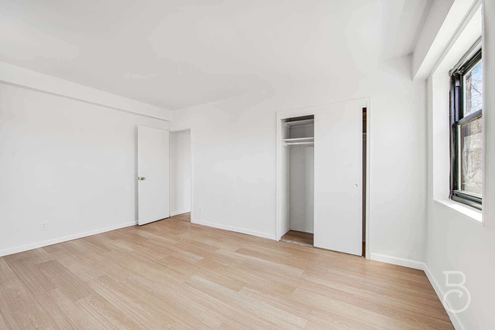 33-65 14th Street, Unit 5D Queens, NY 11106 - Photo 10 of 11 an empty room with windows