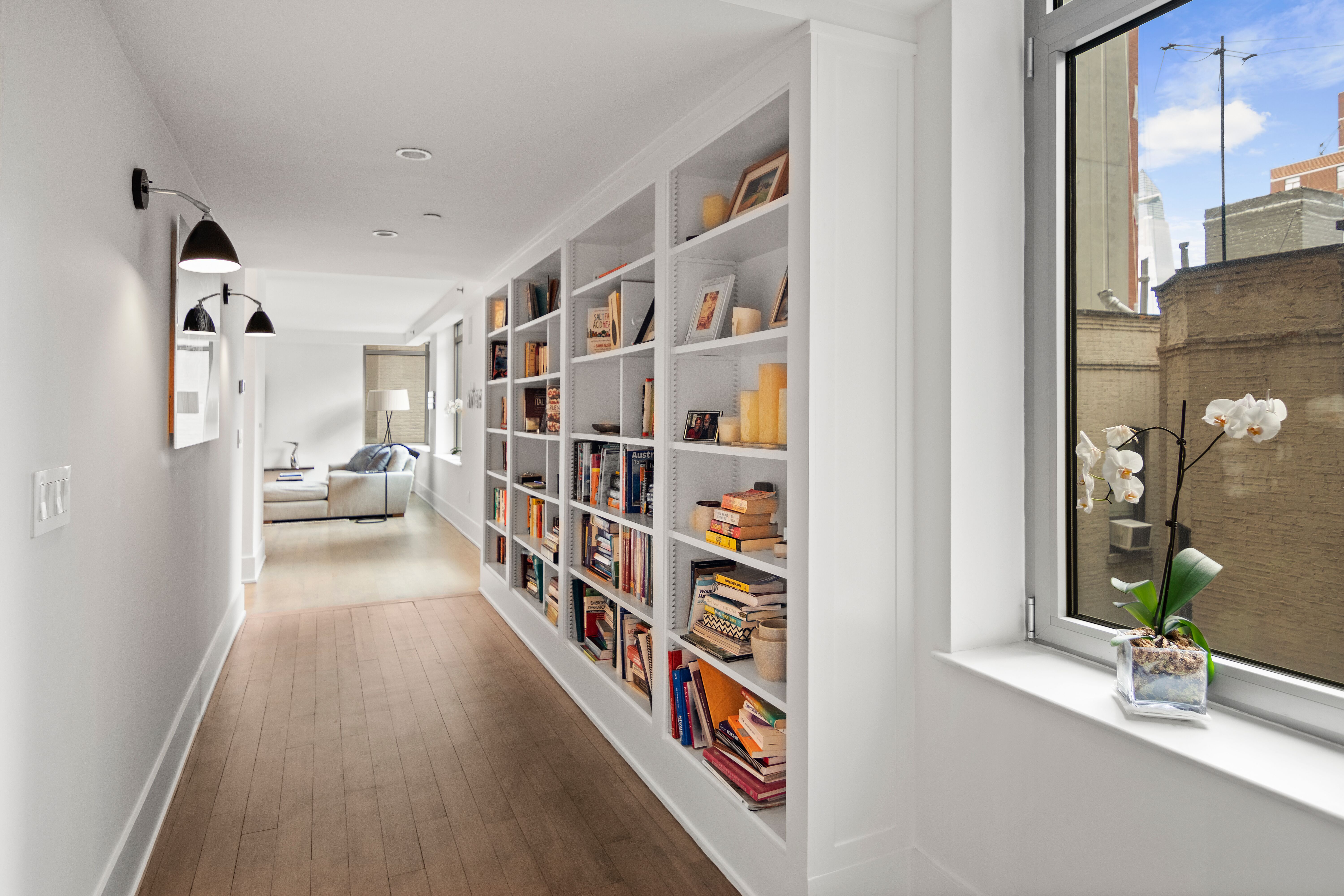 224 West 18th Street, Unit 6C Manhattan, NY 10011 - Photo 6 of 21 a view of a hallway with wooden floor and entryway