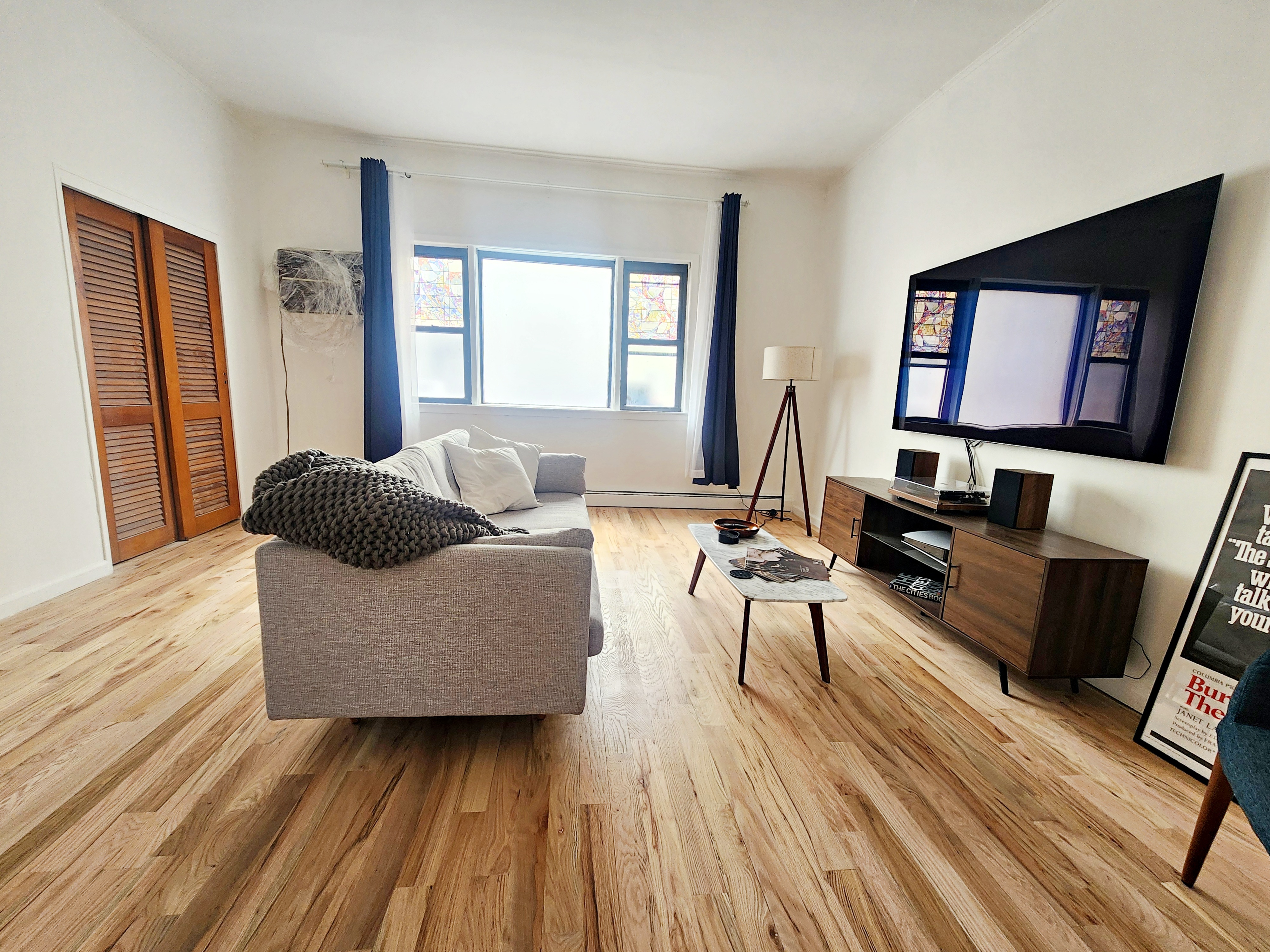 258 Devoe Street, Unit 1 Brooklyn, NY 11211 - Photo 10 of 12 a living room with furniture and a wooden floor