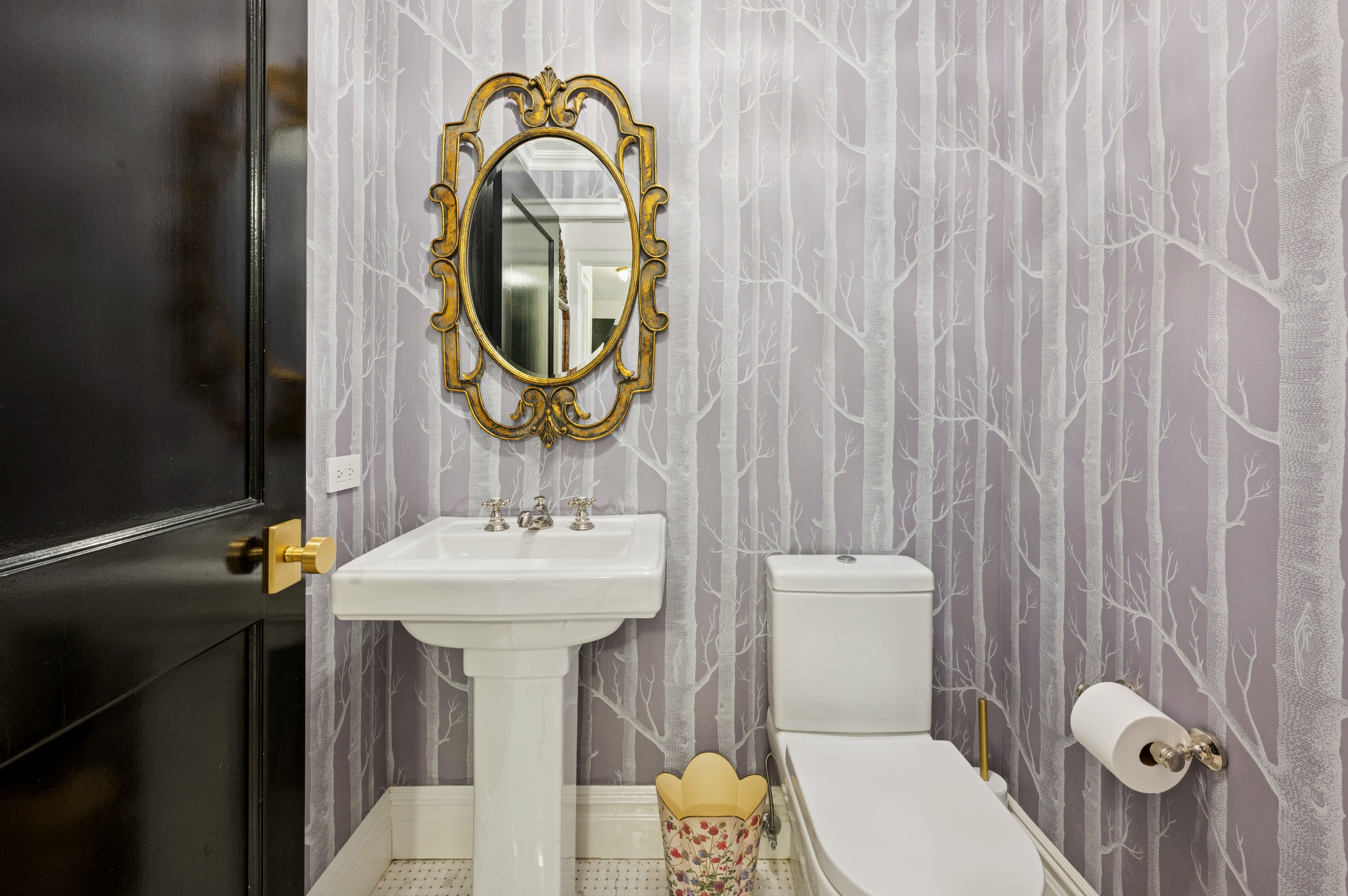 891 Park Avenue, Unit 10 Manhattan, NY 10075 - Photo 13 of 27 a bathroom with a sink a toilet and a mirror