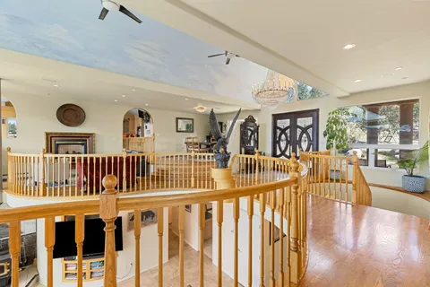 a view of a room with a large window and a table