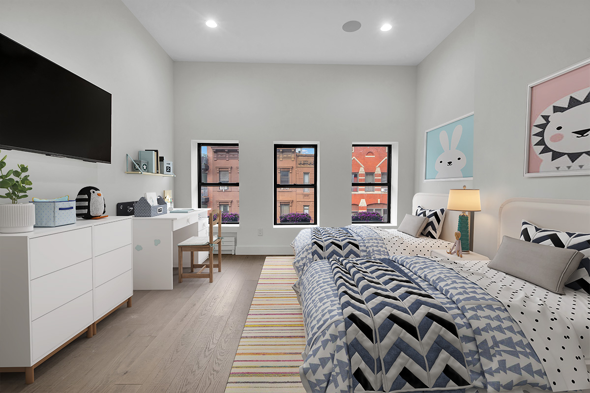 208 West 122nd Street Manhattan, NY 10027 - Photo 10 of 22 a bedroom with a bed and a flat screen tv