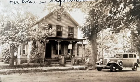 a front view of a house with parking space