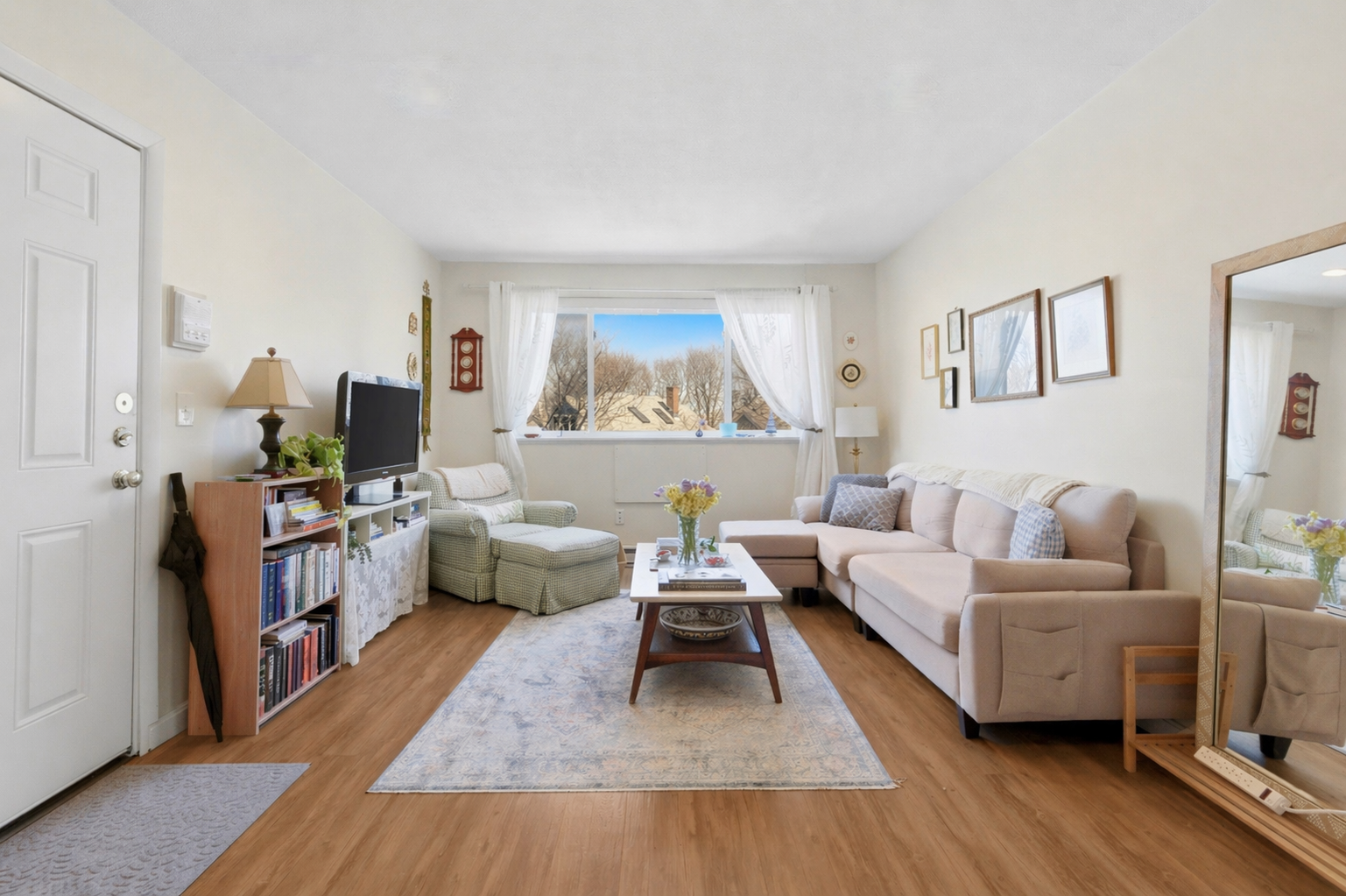 197 Calumet Street, Unit 10 Boston, MA 02120 - Photo 1 of 10 a living room with furniture and a wooden floor