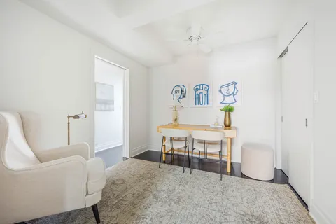 a view of walk in closet and bedroom