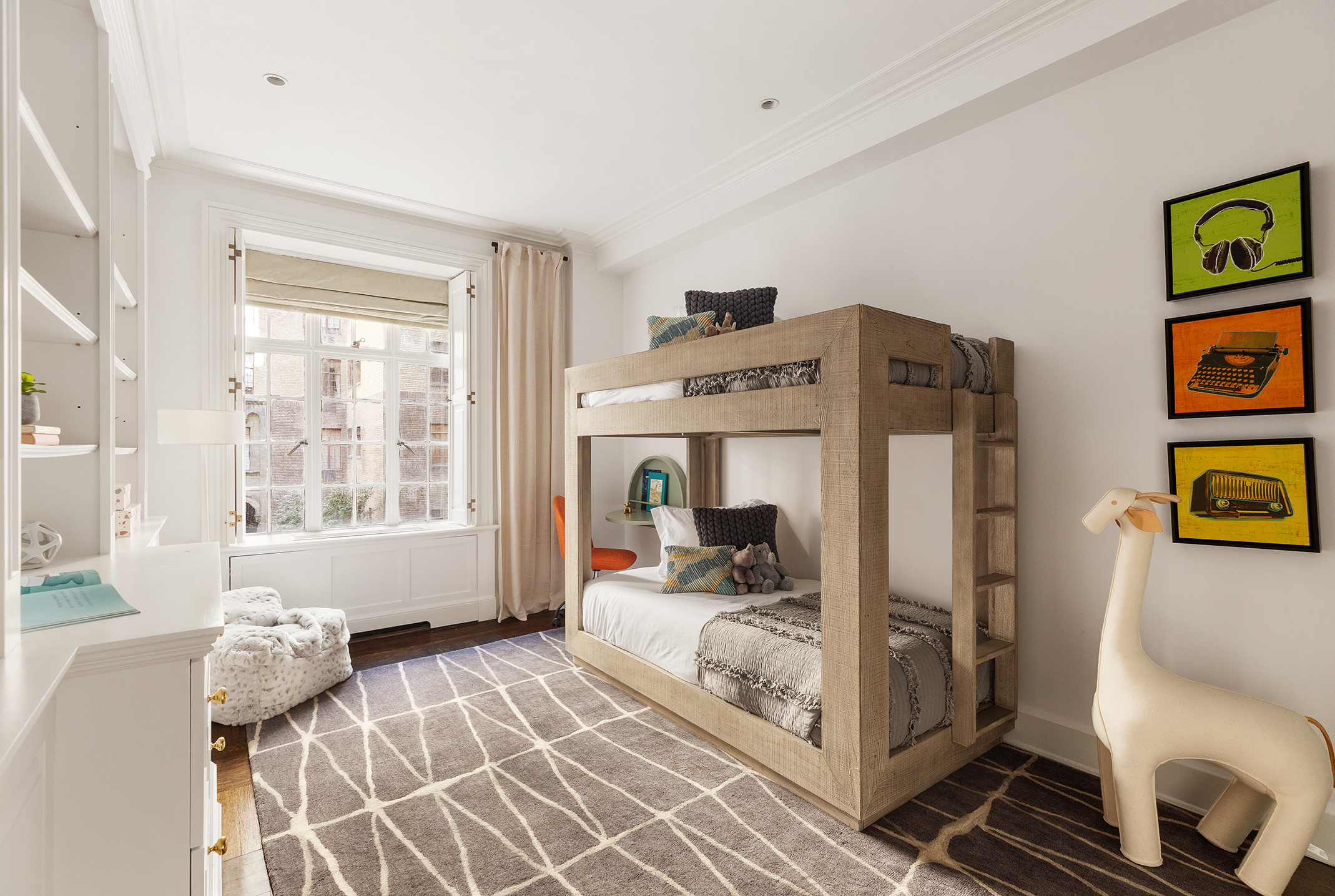 115 East 67th Street, Unit 3C Manhattan, NY 10065 - Photo 13 of 21 a bedroom with a bed and wooden floor