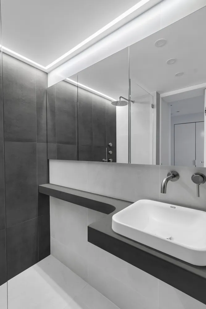 a bathroom with a sink and a mirror