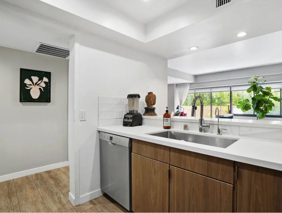 a kitchen with a sink and a window