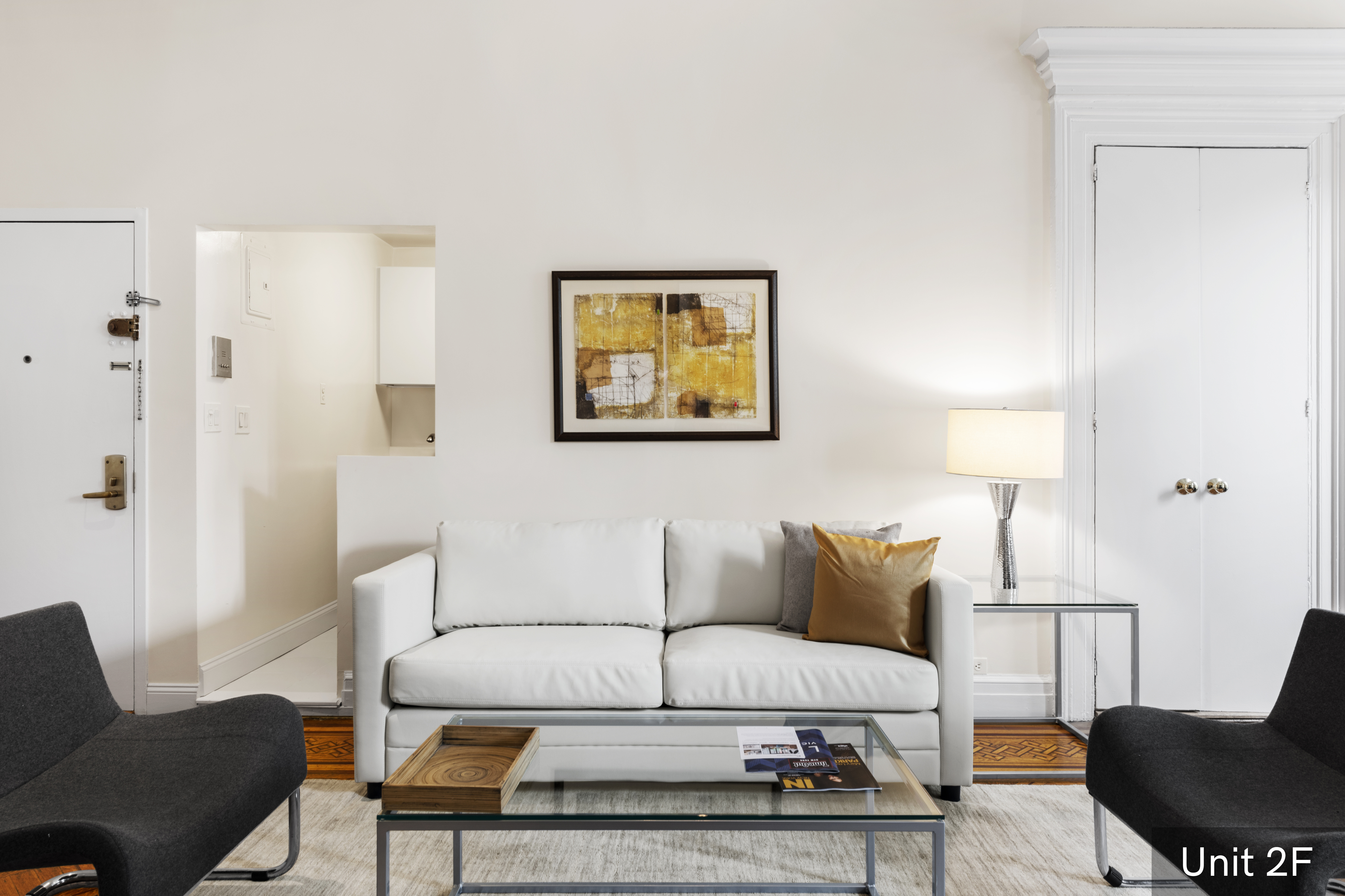 120 East 19th Street Manhattan, NY 10003 - Photo 22 of 33 a living room with furniture a couch and a potted plant