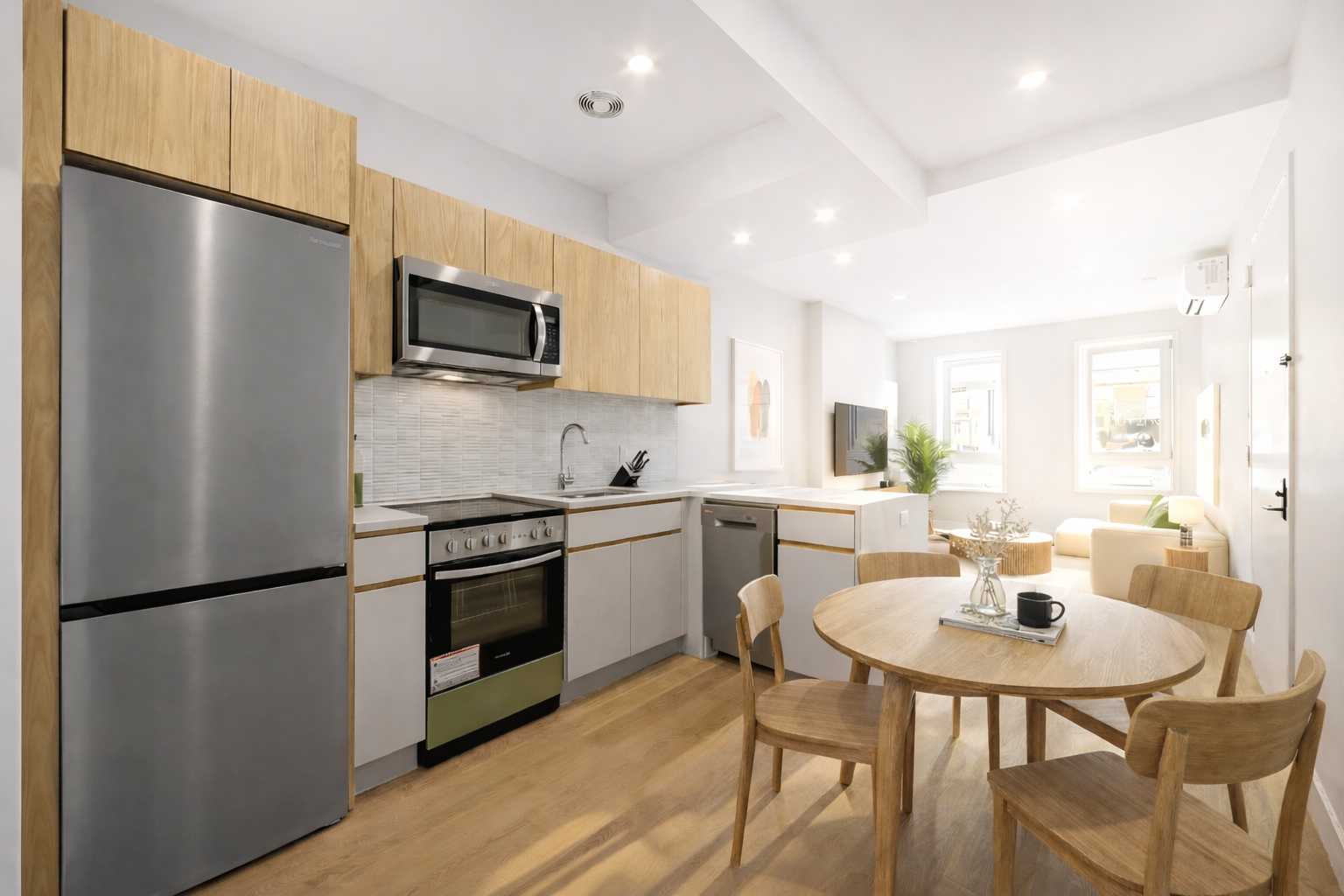 242 6th Street, Unit 3A Brooklyn, NY 11215 - Photo 2 of 5 a kitchen with stainless steel appliances a dining table a stove a refrigerator with a dining table and chairs