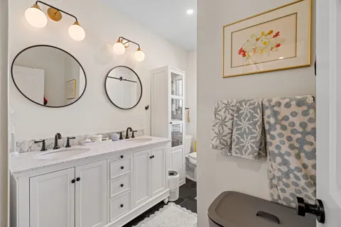 a bathroom with a toilet and a shower