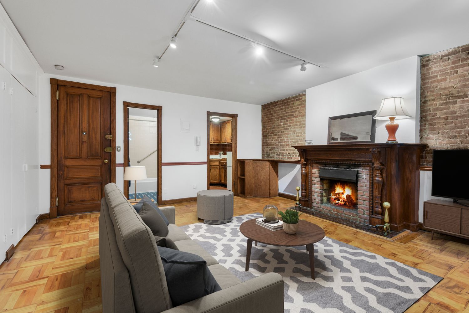 a living room with furniture and a fireplace
