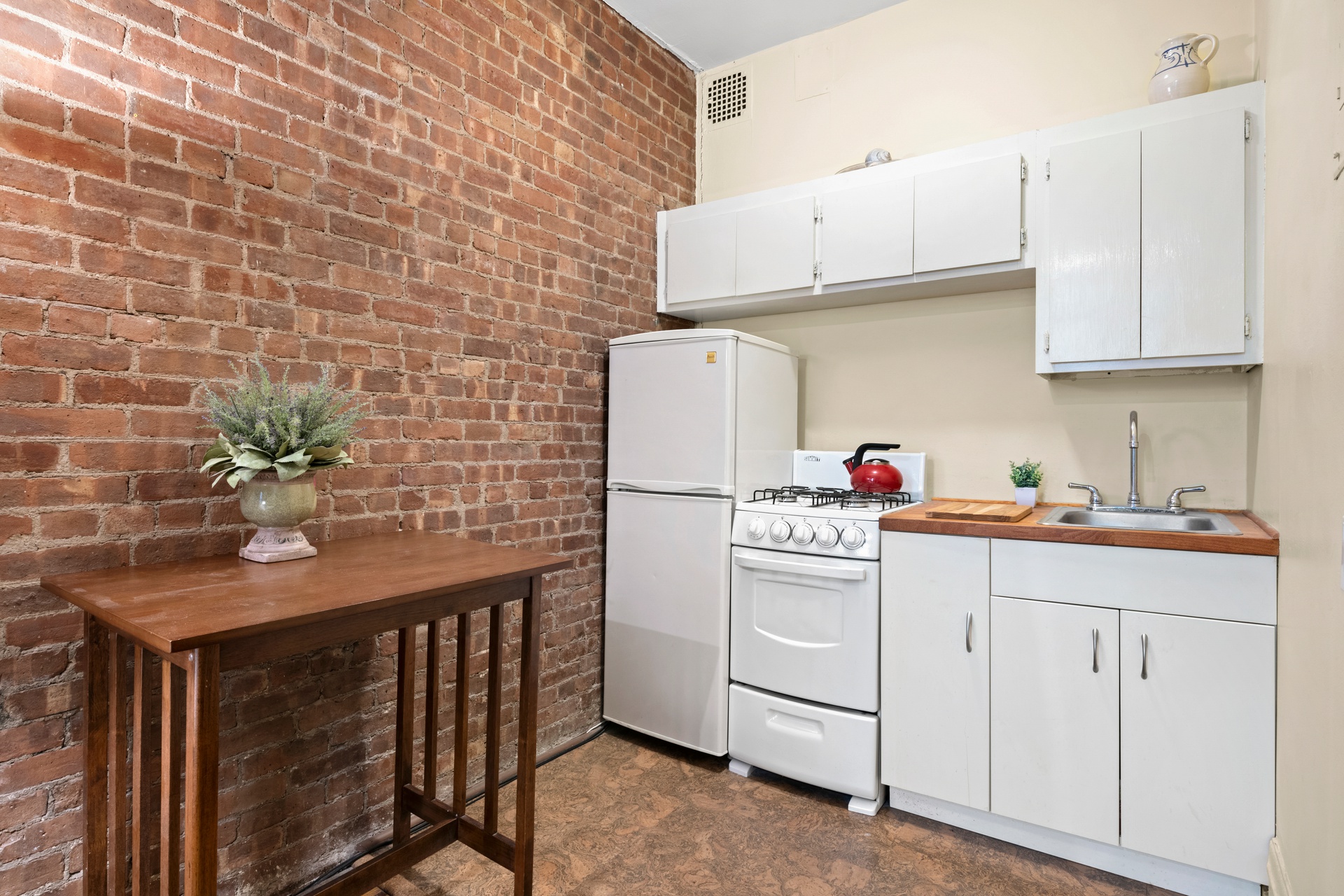 293 Riverside Drive, Unit 2B Manhattan, NY 10025 - Photo 4 of 6 a utility room with cabinets washer and dryer