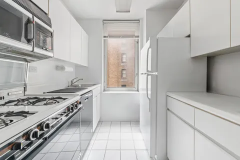 a kitchen with a stove and a refrigerator