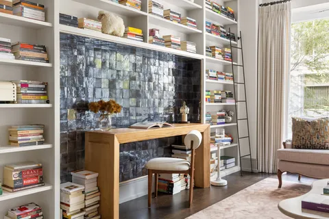 a dining room with furniture and wooden floor
