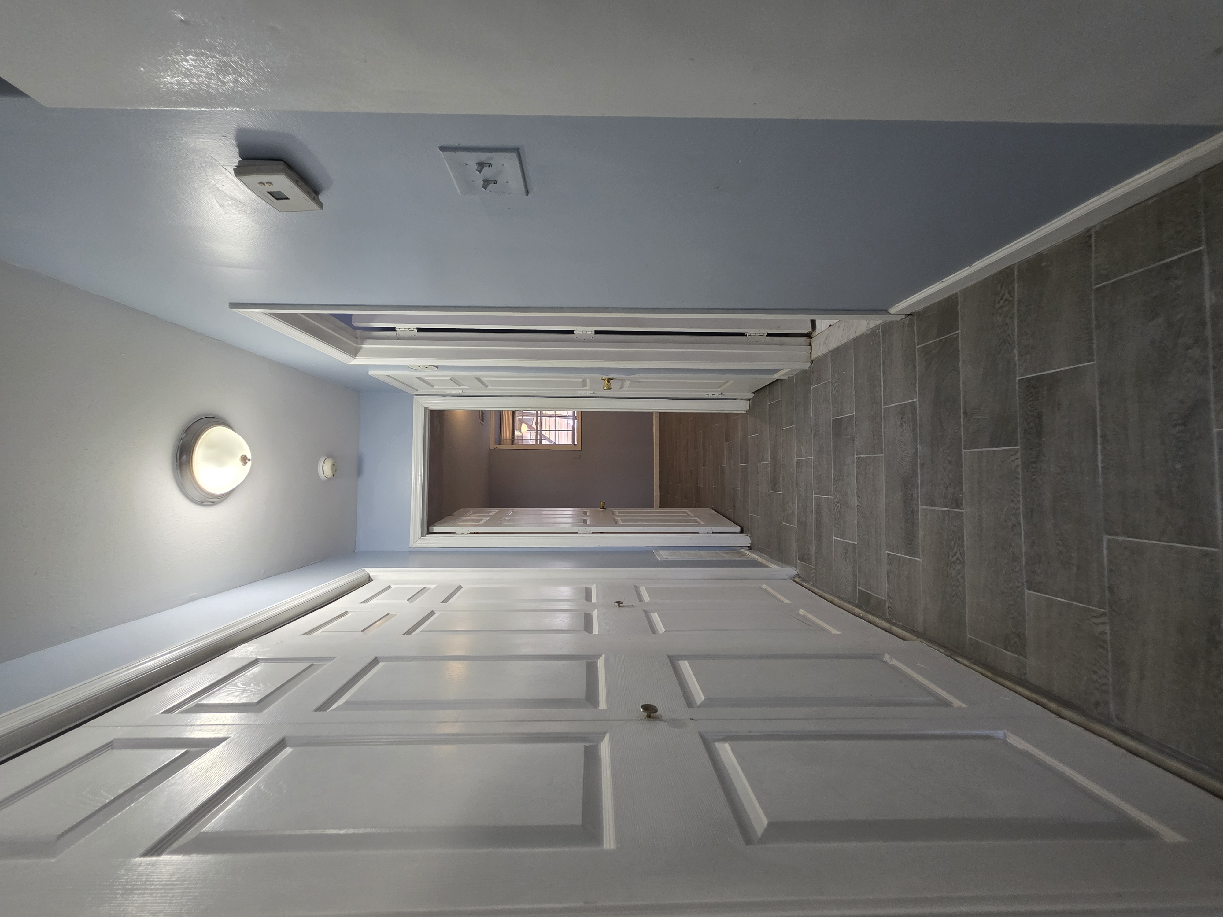 216 Pond Way, Unit 1 Staten Island, NY 10303 - Photo 6 of 9 a view of a hallway