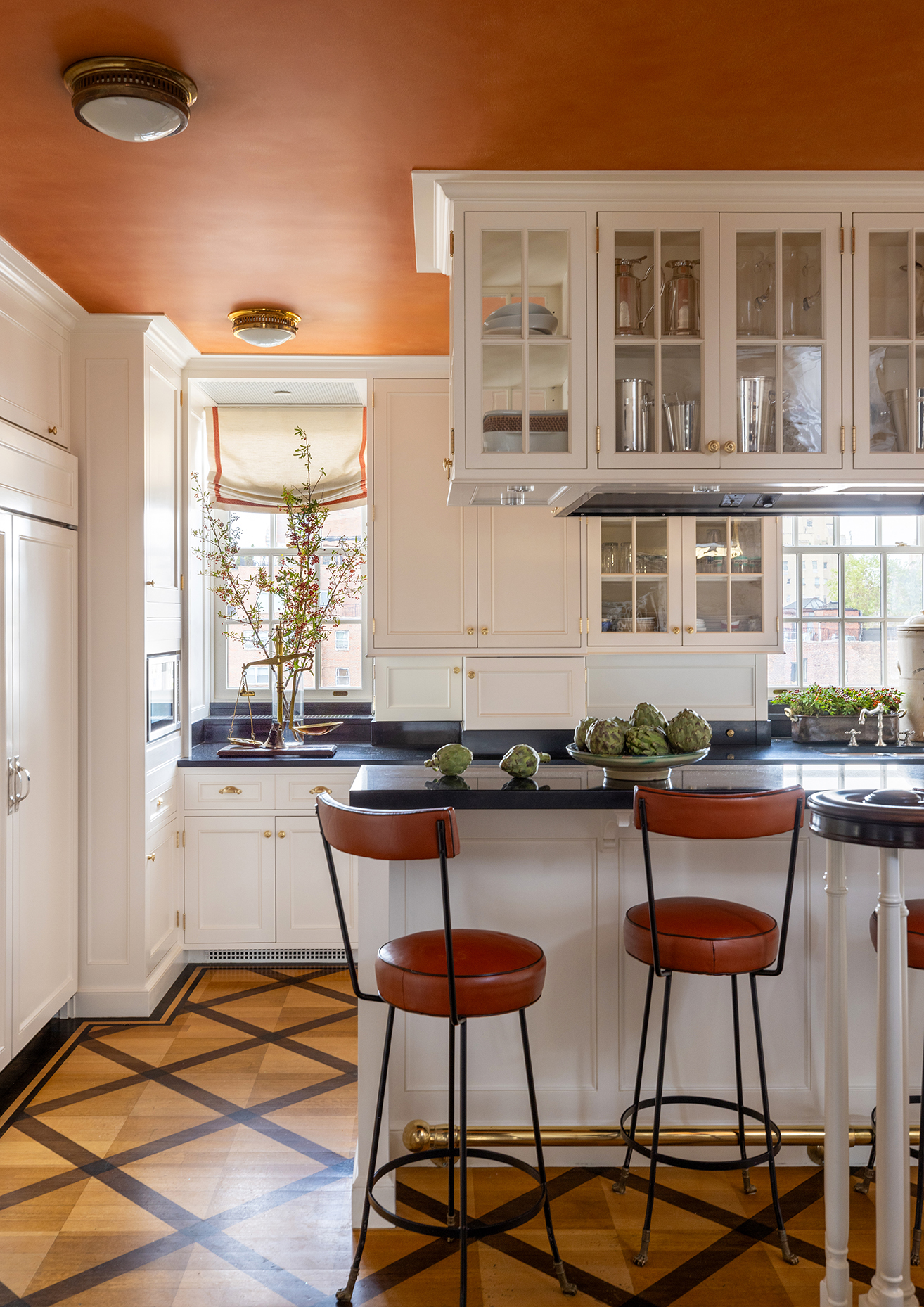 620 Park Avenue, Unit 14 Manhattan, NY 10065 - Photo 23 of 32 a view of a kitchen with dining table and chairs
