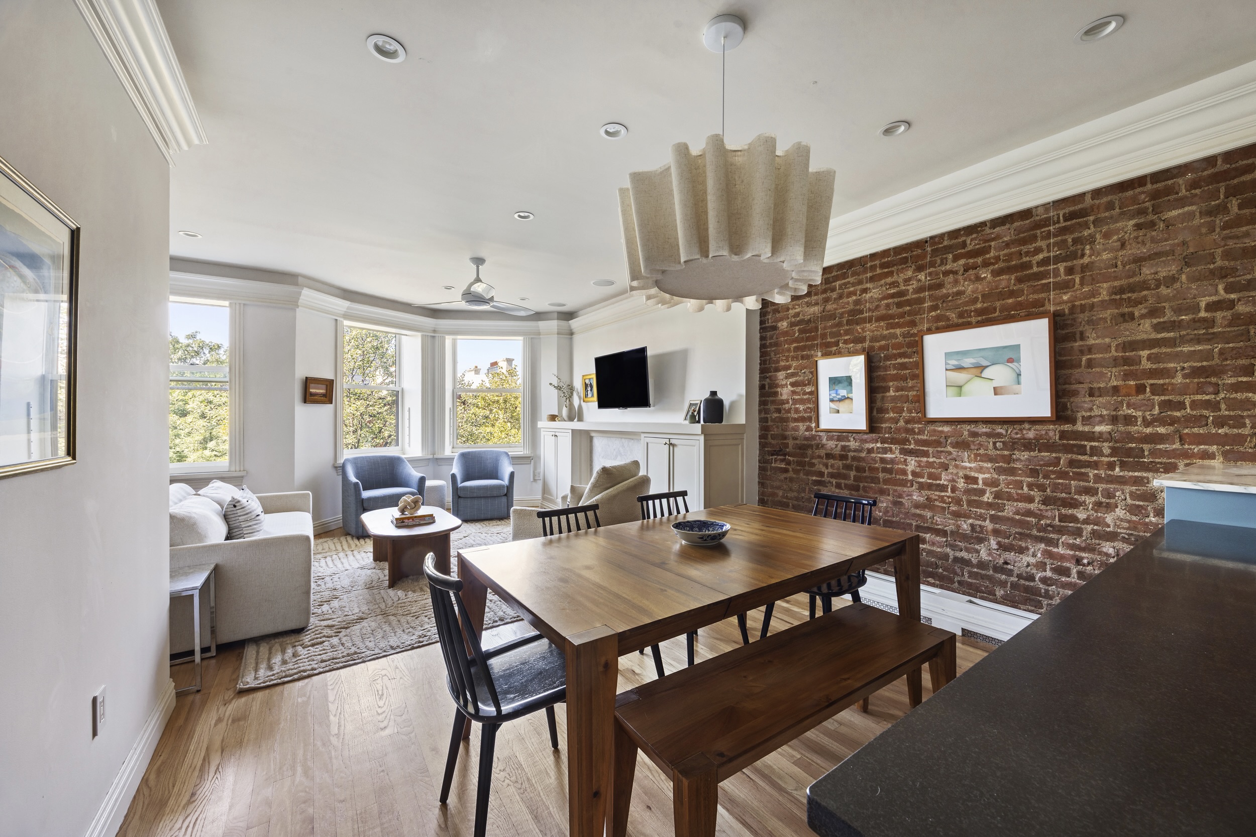209 Clinton Street, Unit 4L Brooklyn, NY 11201 - Photo 5 of 17 a view of a dining room with furniture window and wooden floor