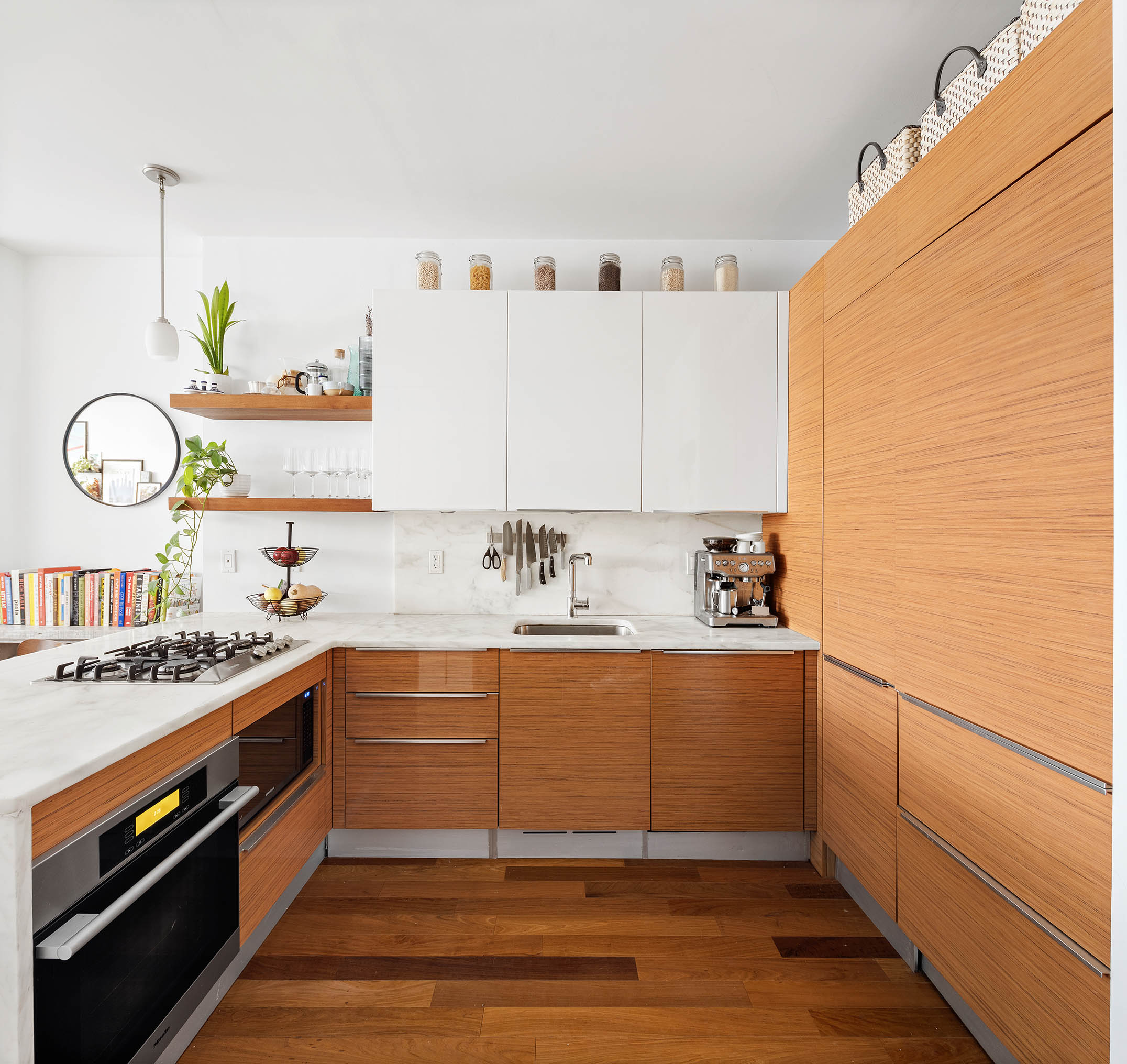 130 West 20th Street, Unit 1B Manhattan, NY 10011 - Photo 4 of 8 a view of cabinets a sink and wooden floor