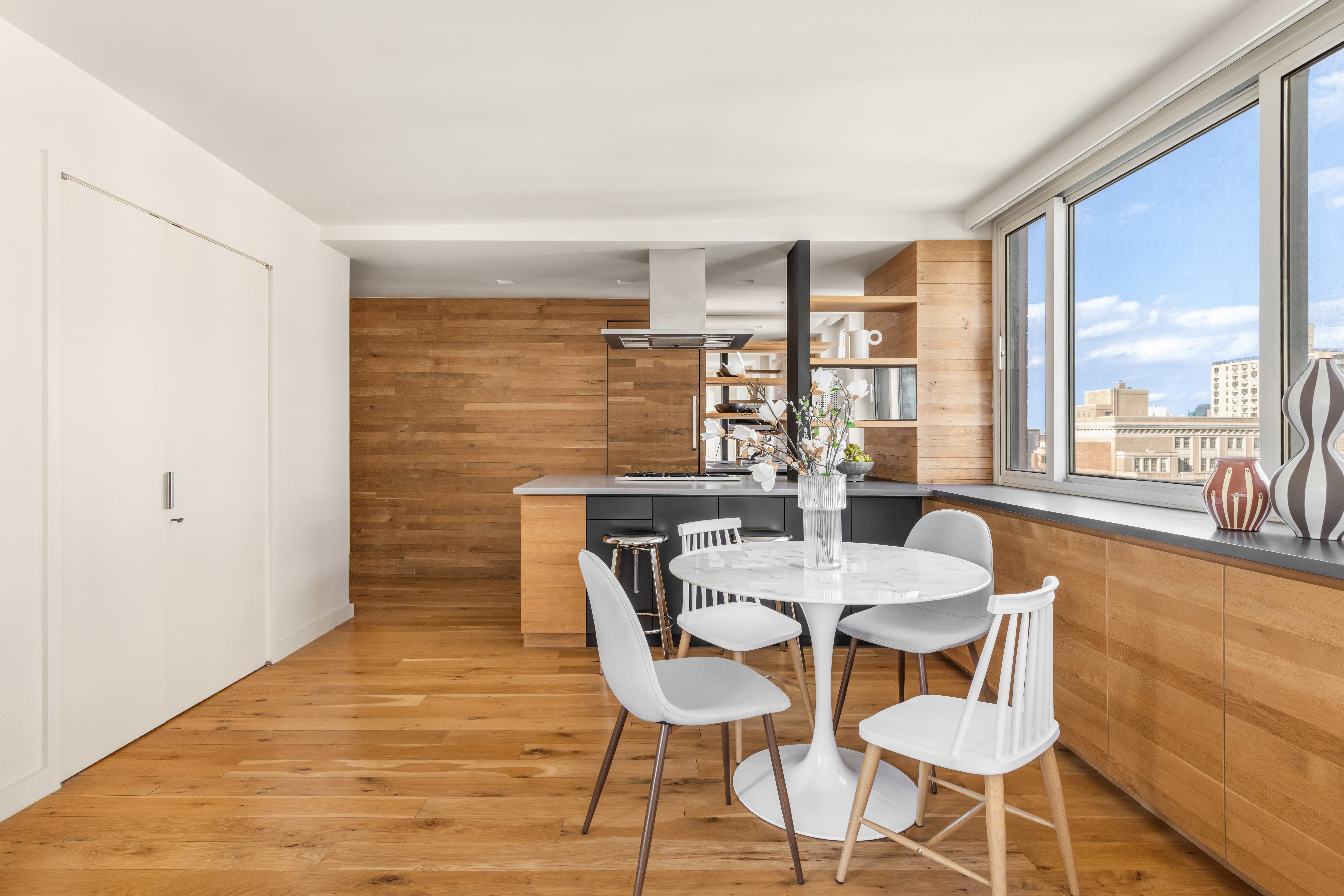1 Irving Place, Unit G20A Manhattan, NY 10003 - Photo 2 of 14 a dining room with furniture and wooden floor