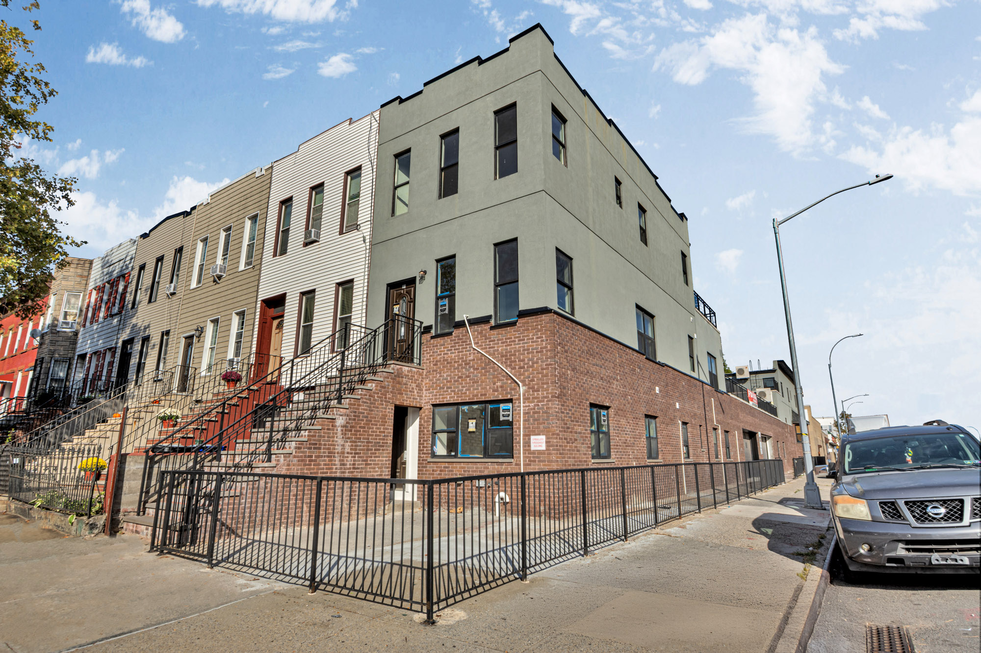 31 Roosevelt Place, Unit 1A Brooklyn, NY 11233 - Photo 13 of 14 a large building with a white roof