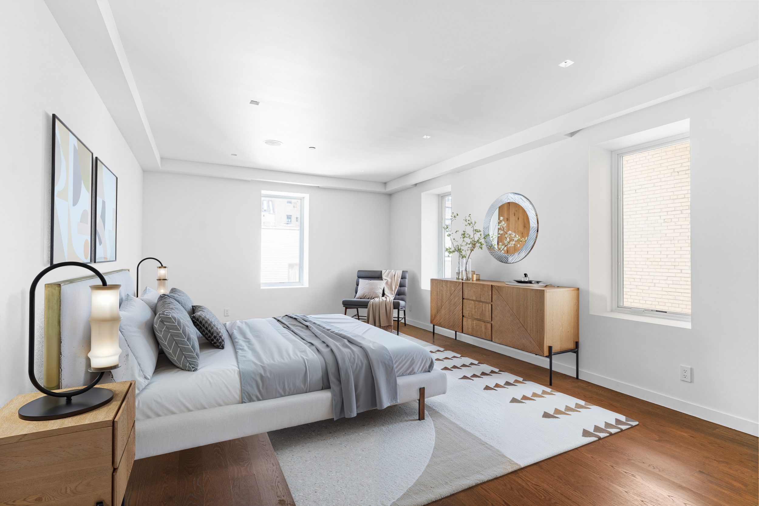 135 East 38th Street Manhattan, NY 10016 - Photo 24 of 32 a bedroom with bed and window